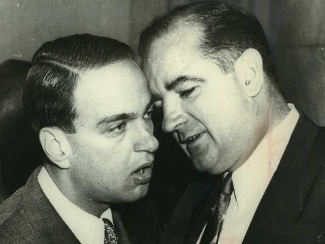 The late Senator Joseph McCarthy (right) whispered to Roy Cohn at the height of the Army-McCarthy hearings in Washington.