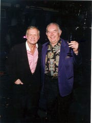 Robin Leach with the late Hugh Hefner, at Studio 54 in Las Vegas in July 2002.