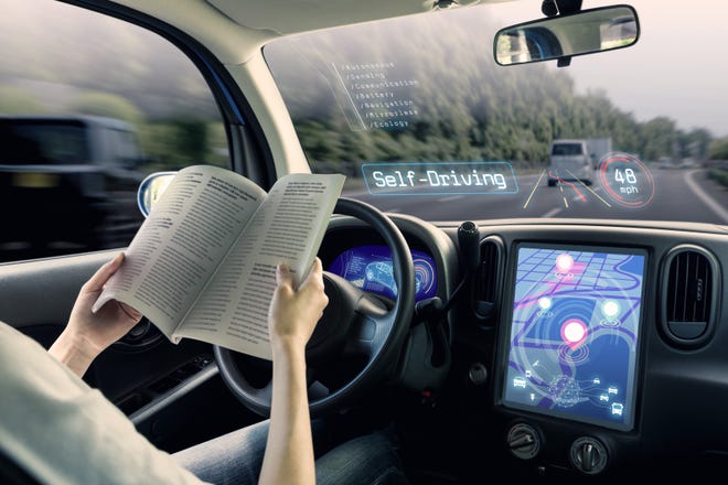 In theory, someone behind the wheel of a self-driving car could kick back and read a book, and leave road worries to the vehicle.