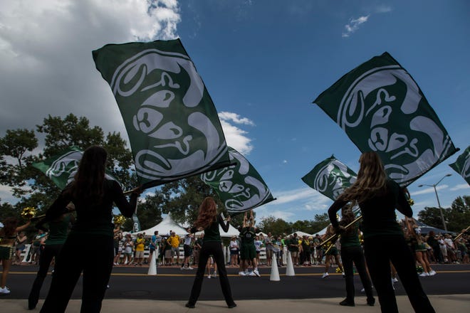 Colorado State University cheerleaders entertain the crowd before a game against the University of Hawaii Rainbow Warriors on Saturday, Aug. 25, 2018, at Canvas Stadium in Fort Collins, Colo. 