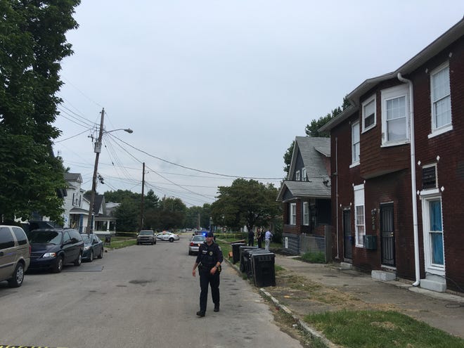 Fourth division LMPD officers respond to a fatal shooting in the 400 block of M St. on August 25, 2018.