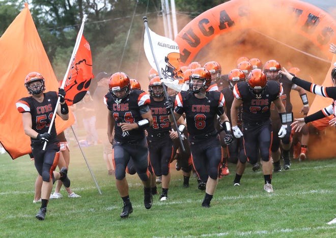 The Lucas football team takes to the field while playing a home game against Danville earlier in the season.