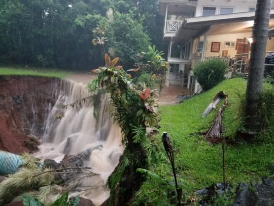 The former backyard of a house in the town of Papaikou just north of Hilo on the island of Hawaii. Heavy rains brought by Hurricane Lane caused a stream to overflow and wash the yard away.