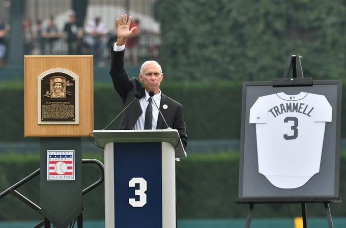 Between his Hall of Fame plaque and his No 3 jersey, Alan Trammell waves to the crowd while he speaks during a special pregame ceremony to retire his number.