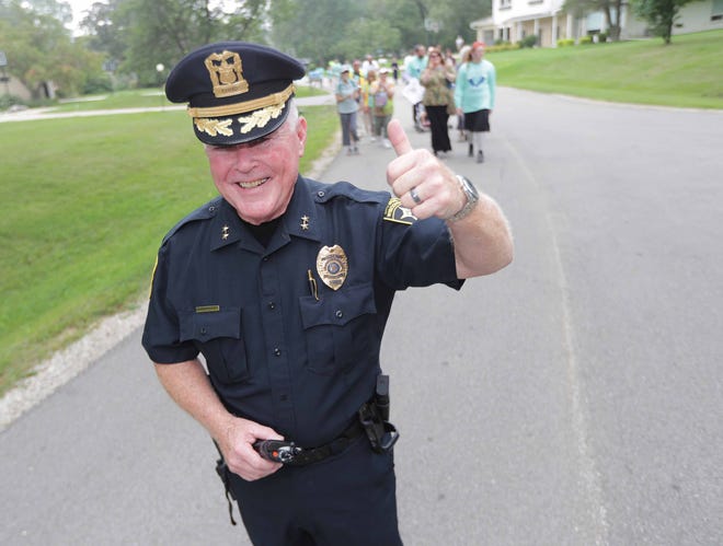 Bayside Police Chief Douglas Larsson gives the thumbs-up during the Walk4Friendship walk in August 2018. Larsson is implementing a new neighborhood policing initiative to strengthen relationships between police and the community.