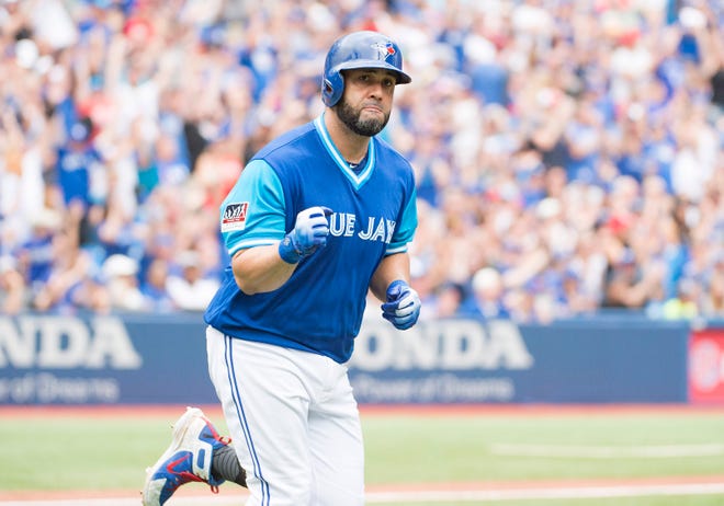 Toronto Blue Jays designated hitter Kendrys Morales celebrates after hitting a home run during the third inning against the Philadelphia Phillies.