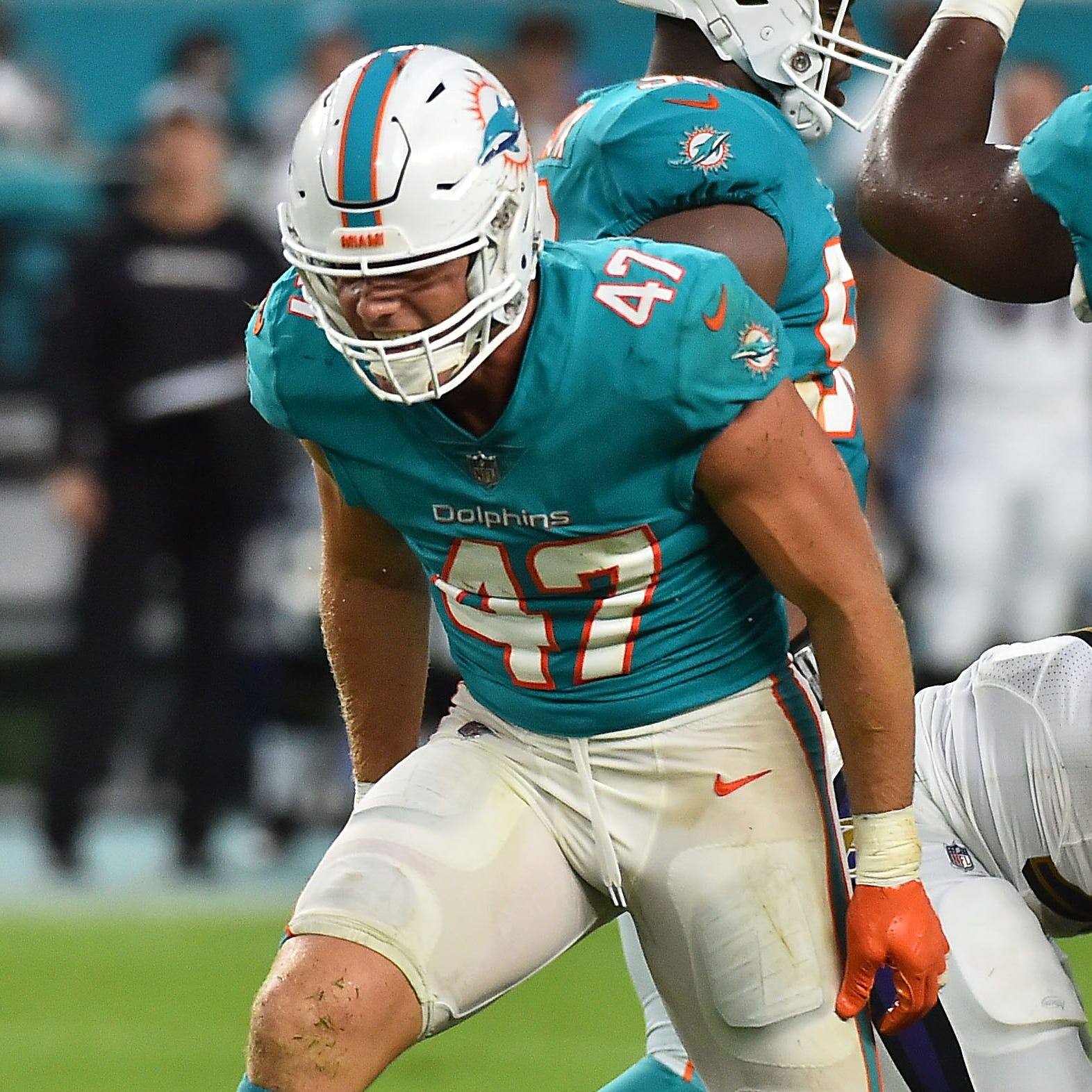 Miami Dolphins linebacker Kiko Alonso (47) celebrates after tacking Baltimore Ravens running back Gus Edwards (35) during the first half at Hard Rock Stadium.