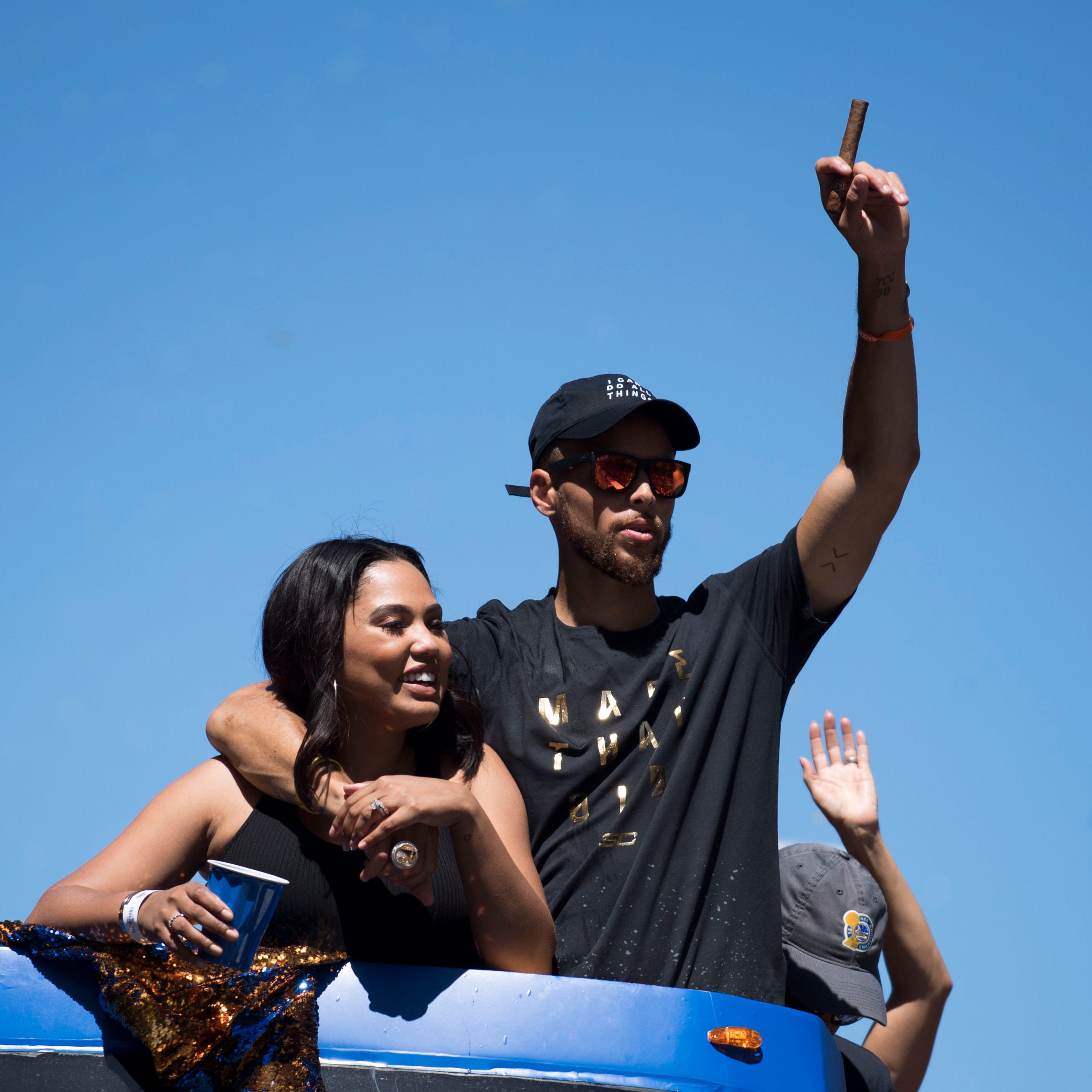 June 15, 2017; Oakland, CA, USA; Golden State Warriors guard Stephen Curry (30) waves to the crowd with wife Ayesha Curry (left) during the Warriors 2017 championship victory parade in downtown Oakland. Mandatory Credit: Kyle Terada-USA TODAY Sports