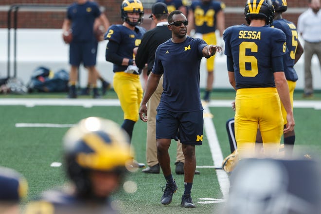 Michigan assistant Pep Hamilton talks to players during an open practice at the Michigan Stadium in Ann Arbor, Sunday, Aug. 26, 2018.