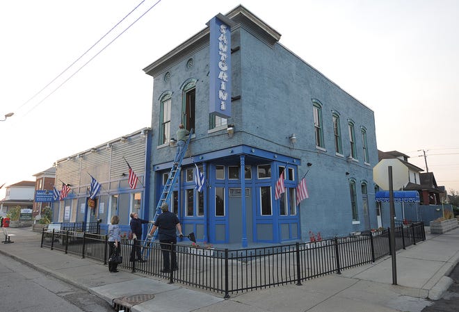 Investigators check out Santorini'Greek Kitchen following a 2010 fire that closed the Fountain Square restaurant for two months. Santorini continued successfully thereafter, but shuttered for good in March 2018 when the owners decided to focus attention on their catering business.