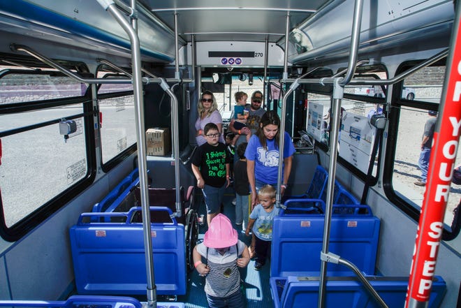 Attendees explore the inside of a Roadrunner Transit bus Saturday, Aug. 25, 2018 at the annual Touch-a-Truck event at Camino Real Middle School.