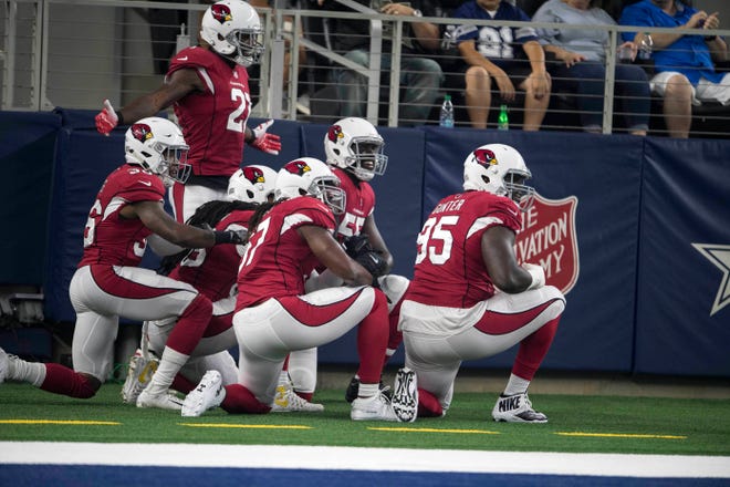 Aug 26, 2018; Arlington, TX, USA; Arizona Cardinals defensive back Patrick Peterson (21) and defensive tackle Rodney Gunter (95) and linebacker Josh Bynes (57) and defensive end Chandler Jones (55) celebrate a touchdown by Peterson against the Dallas Cowboys during the first quarter at AT&T Stadium. Mandatory Credit: Jerome Miron-USA TODAY Sports