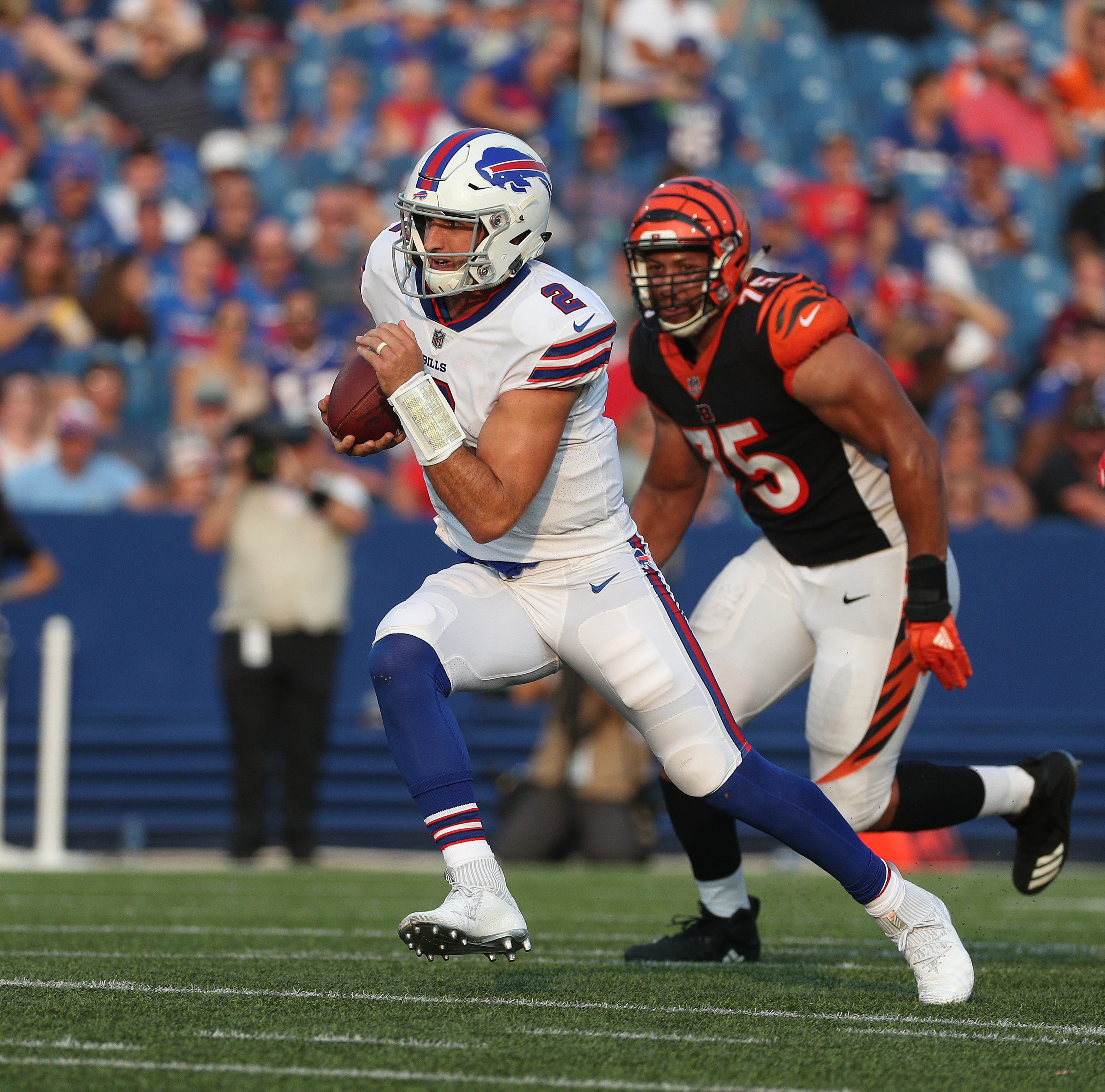 Bills quarterback Nathan Peterman scrambles for a first down against the Bengals.