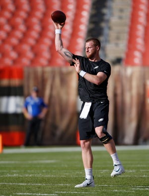 Philadelphia Eagles quarterback Carson Wentz warms up before an NFL football game between the Cleveland Browns and the Eagles, Thursday, Aug. 23, 2018, in Cleveland. (AP Photo/Ron Schwane)