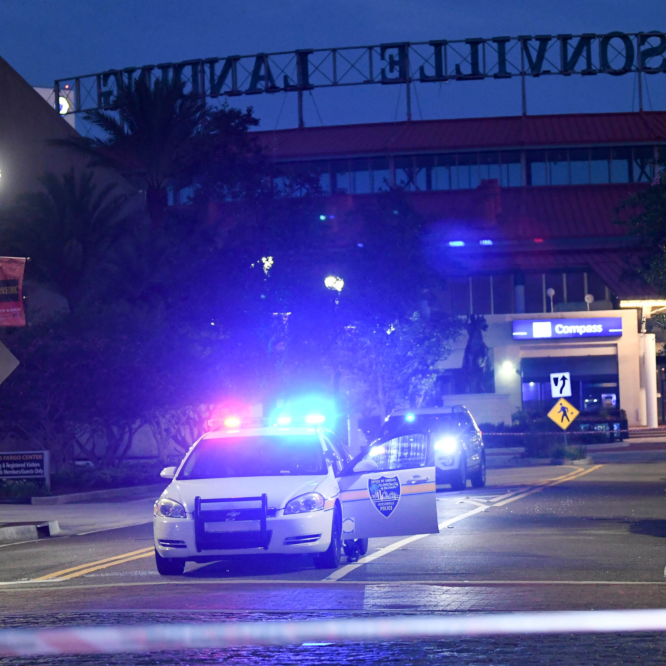 Police vehicles block the roads leading to Jacksonville Landing where four people were killed and several wounded at a Madden 19 tournament. (Via OlyDrop)