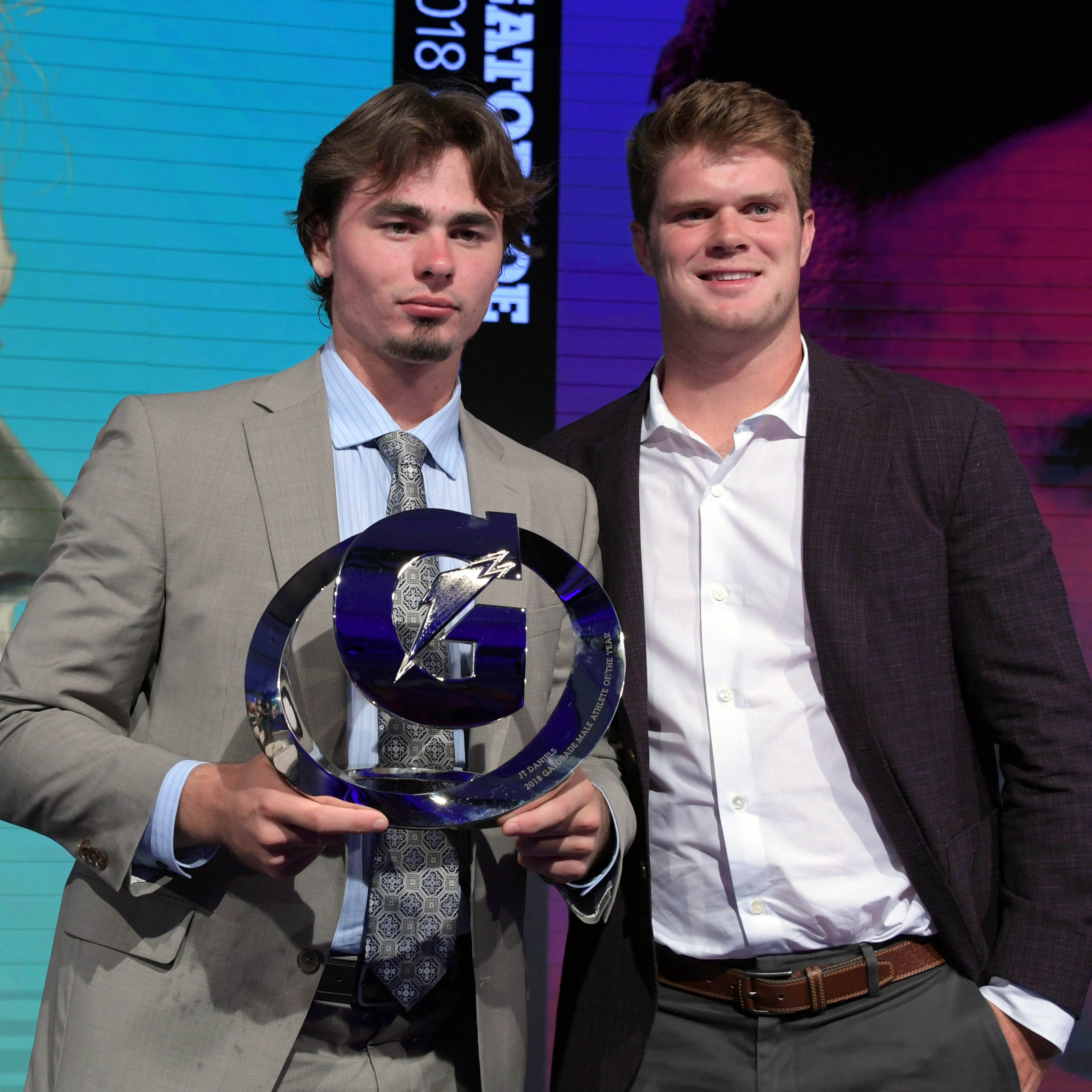 JT Daniels (left) poses with Sam Darnold after being named the male winner during the Gatorade Athlete of the Year Awards.