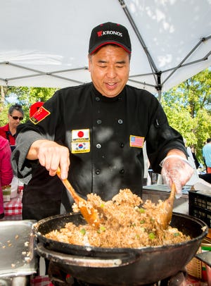 Chef Albert Yee stirs up a fresh batch of traditional chicken fried rice at the 2016 Taste of Mequon. This year's event is scheduled for Saturday, Sept. 8.