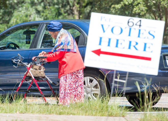 92-year-old Violet Glover gets into her car after voting at the 64th Precinct's Cokesbury United Methodist church location on 9th Avenue in Pensacola on Tuesday, August 28, 2018.  Glover says that "Voting is a privilege and I have never failed to vote."