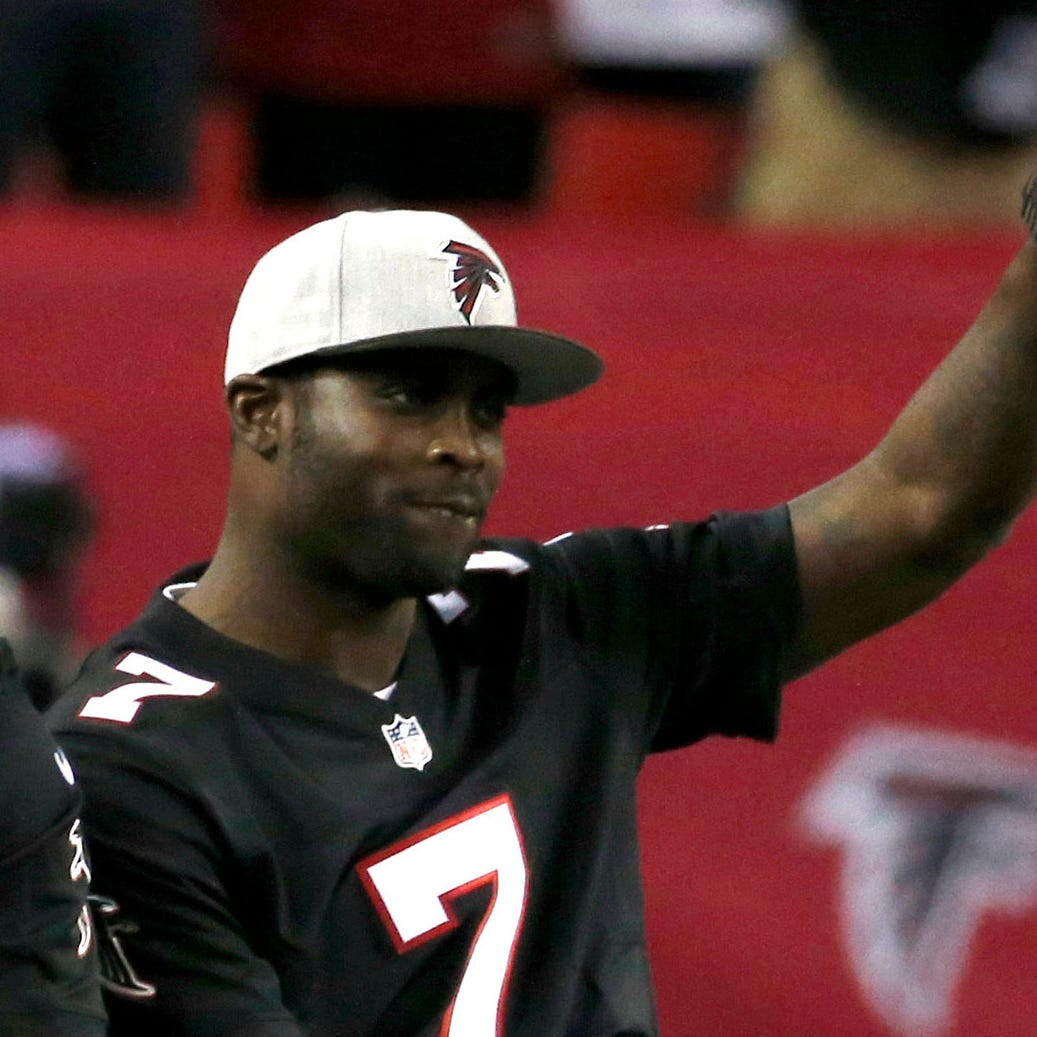 Former Atlanta Falcons quarterback Michael Vick is honored during halftime of a Falcons game in 2017.