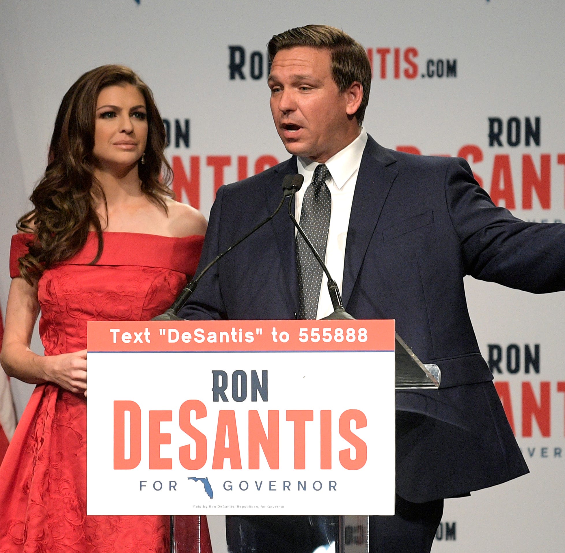 Florida Republican gubernatorial candidate Ron DeSantis, right, speaks to supporters with his wife, Casey, at an election party in Orlando after winning the Republican primary on Tuesday, Aug. 28, 2018.