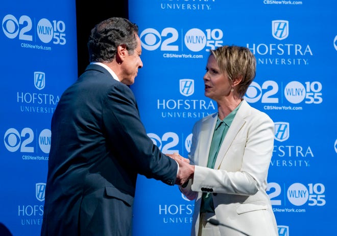New York Gov. Andrew Cuomo, left, shakes hands with Democratic New York gubernatorial candidate Cynthia Nixon before their debate at Hofstra University in Hempstead, N.Y., Wednesday, Aug. 29, 2018. (AP Photo/Craig Ruttle, Pool)