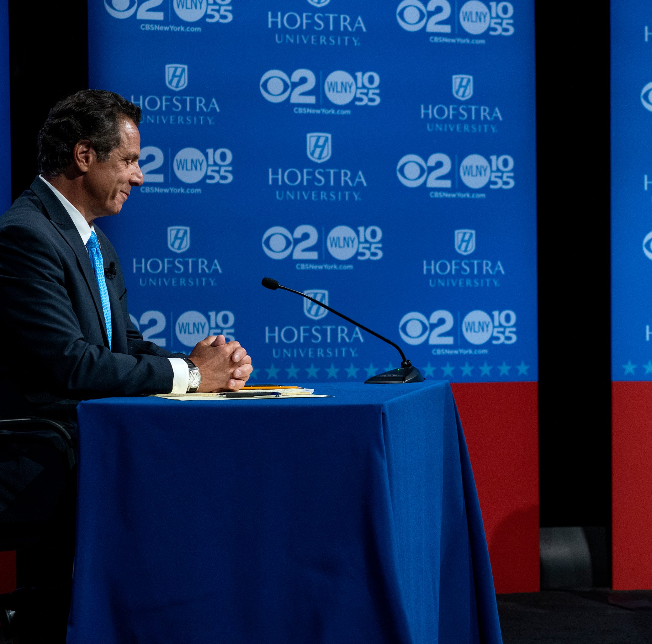 New York Gov. Andrew Cuomo and Democratic New York gubernatorial candidate Cynthia Nixon pause before the start of a gubernatorial debate at Hofstra University in Hempstead, N.Y., Wednesday, Aug. 29, 2018.