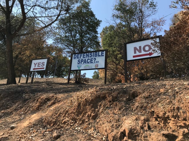 Firefighters at Cal Fire Station No. 58 want passers-by to know the proper way to prepare outdoor space. The display is off Homestake Road and Highway 299 on Tuesday, Aug. 28, 2018.