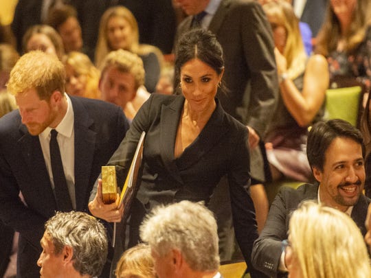 Prince Harry and Duchess Meghan of Sussex sat next to "Hamilton" creator Lin-Manuel Miranda at the gala performance at Victoria Palace Theatre on Aug. 29, 2018, in London.