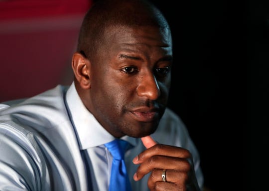 Democratic gubernatorial candidate Andrew Gillum listens as he meets with residents, Monday, Aug. 13, 2018, in the Liberty City neighborhood of Miami. Gillum spoke with residents about gun violence and quality of life in this inner city neighborhood. (AP Photo/Lynne Sladky) ORG XMIT: FLLS104