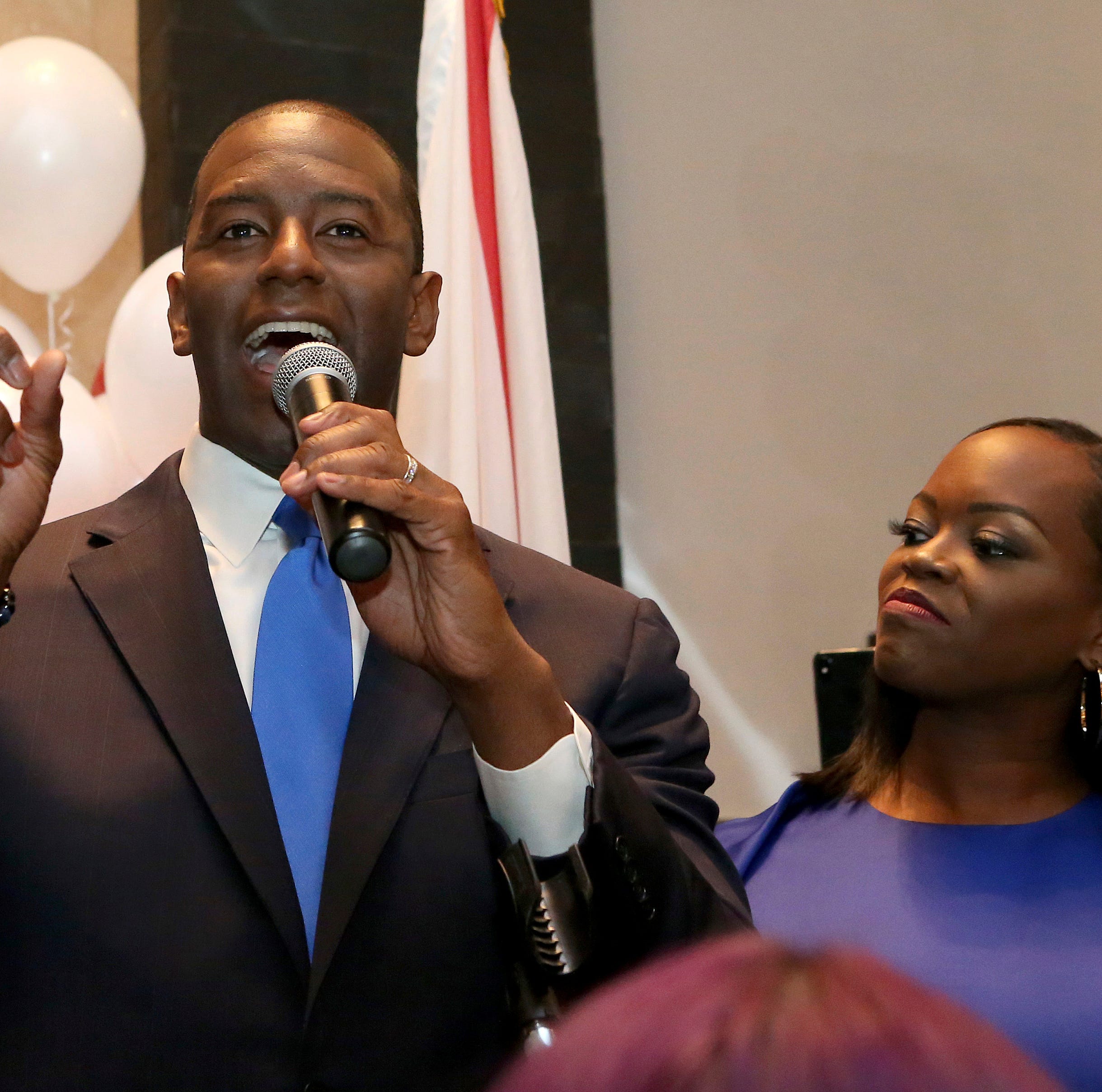 Andrew Gillum with his wife, R. Jai Gillum at his side addresses his supporters after winning the Democrat primary for governor on Tuesday, Aug. 28, 2018, in Tallahassee, Fla.