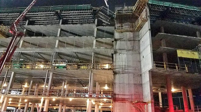 The construction site where two workers fell to their deaths when scaffolding collapsed above the sixth floor of a hotel that is being built near Disney World in Orange County.