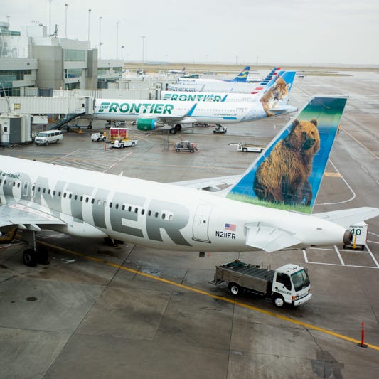 Frontier Airlines jets at Denver International Airport in July 2017.
