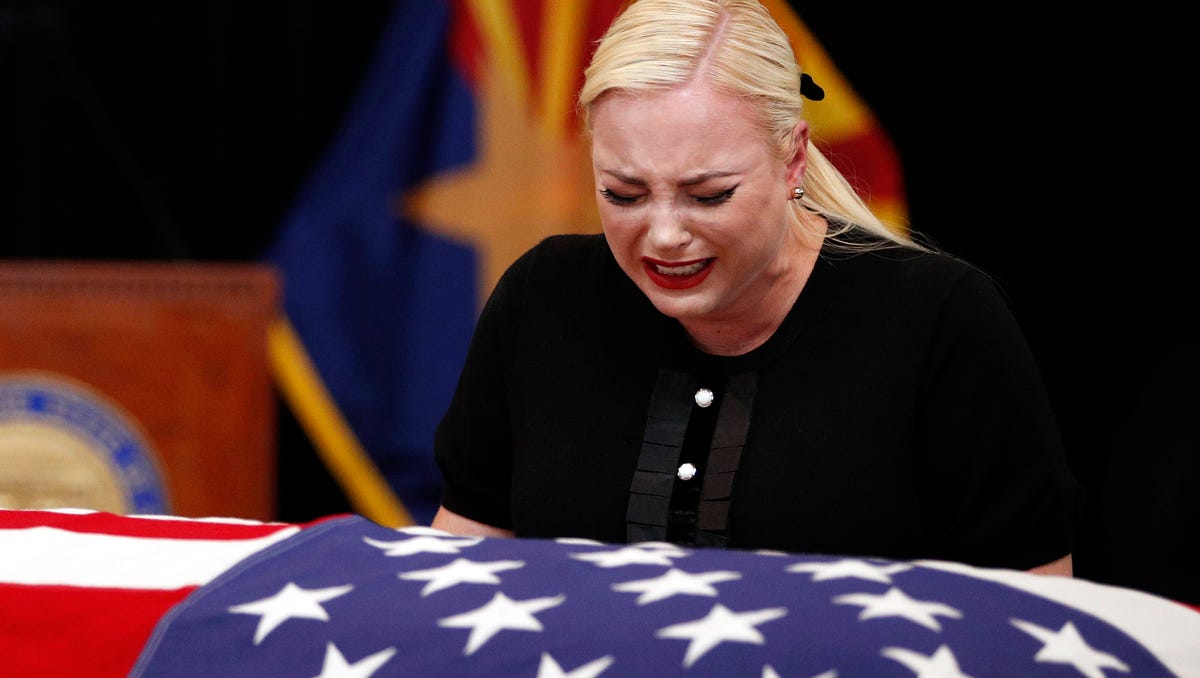 Meghan McCain, daughter of, Sen. John McCain, R-Ariz. cries at the casket of her father during a memorial service at the Arizona Capitol on Weds. Aug. 29, 2018, in Phoenix. 