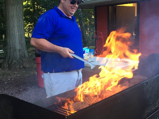 Jon works the grill at Northern Highlands on Thursday.
