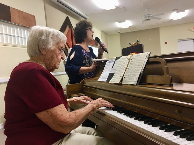 Edith Lively plays for soloist Judi Goldstein at the Village Chapel in Mesa.