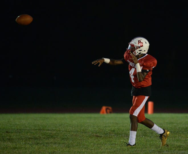 Penns Grove quarterback Kavon Lewis throws a pass last season. Lewis broke the school's career passing touchdown record as the fourth-ranked Red Devils beat Schalick on Saturday.