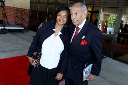 Monica and John Conyers pose for a photograph outside of Aretha Franklin's funeral at Greater Grace Temple in Detroit on Friday, August 31, 2018.