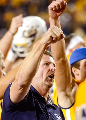 Montana State head coach Jeff Choate celebrates their win over Western Illinois during an NCAA college football game at Bobcat Stadium, Thursday, Aug. 30, 2018, in Bozeman, Mont.