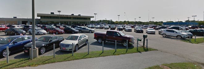 A Menonomonee Falls auto dealership site would be redeveloped as an office park, which could get village financing help under a new proposal.