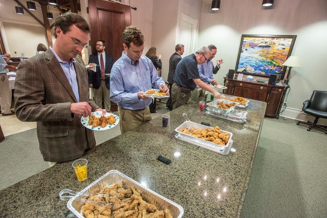 Guests sample the fried chicken, not knowing who made it. The Montgomery law office of Balch & Bingham hosted Drumstickpalooza on Thursday, Aug. 30, 2018, a competition between local restaurants to determined who makes the best drumstick in the River Region. 