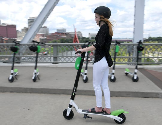 Emma Green and Lime participated in the launch of the Nashville Electric Scooter on the John Seigenthaler Pedestrian Bridge on August 31, 2018.