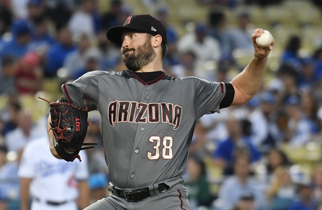 Arizona Diamondbacks starting pitcher Robbie Ray (38) pitches against the Los Angeles Dodgers in the first inning at Dodger Stadium.