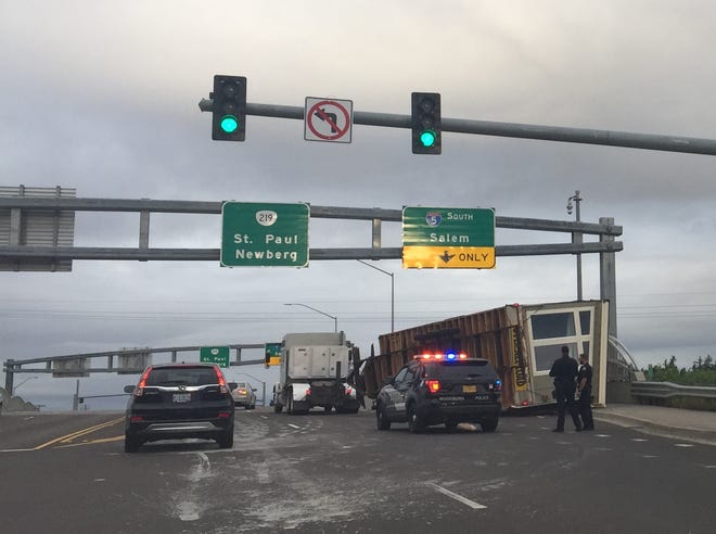 An overturned manufactured home blocks lanes on the I-5 overpass in Woodburn Friday morning.