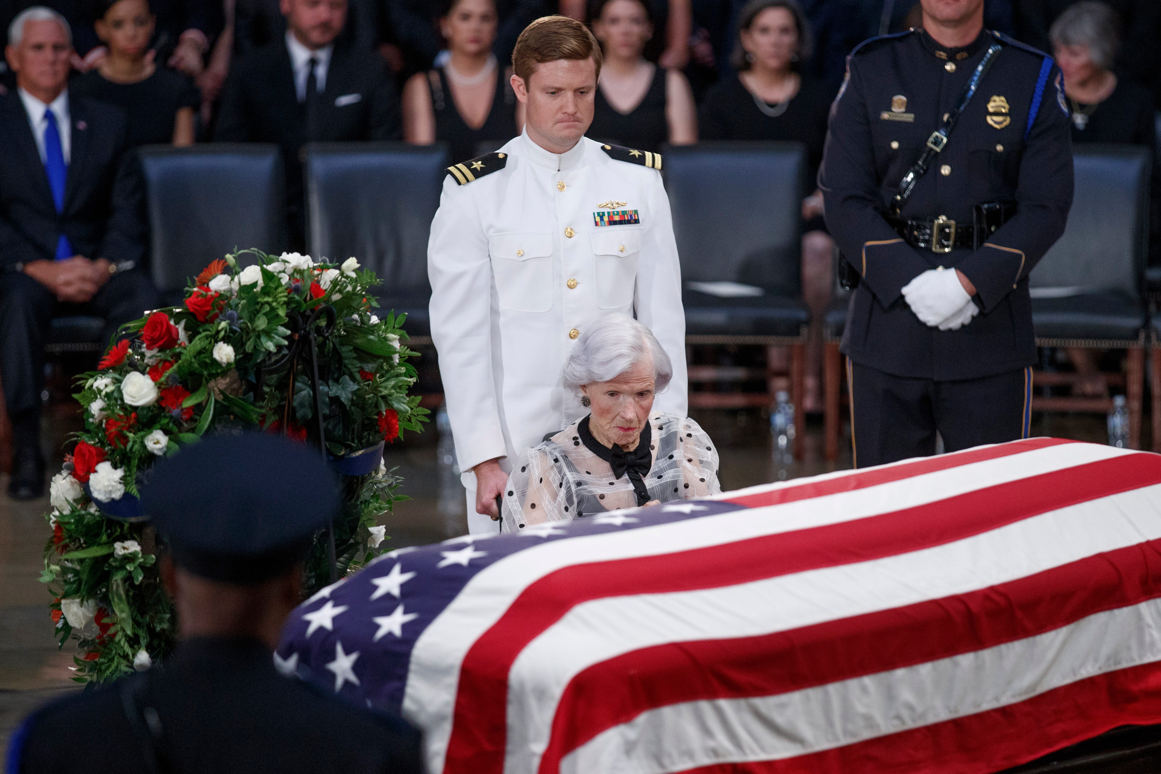 Roberta McCain, 106, takes a moment at the casket of her son, Sen. John McCain, after a memorial service in the Rotunda of the U.S. Capitol, where he lay in state Aug. 31, 2018.