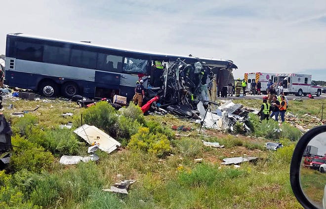 This photo provided by Chris Jones shows first responders working the scene of a collision between a Greyhound passenger bus and a semi-truck on Interstate 40 near the town of Thoreau, N.M., near the Arizona border, Thursday, Aug. 30, 2018. Multiple people were killed and others were seriously injured.