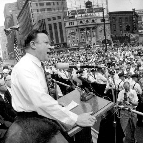 UAW leader Walter Reuther took a few minutes off f
