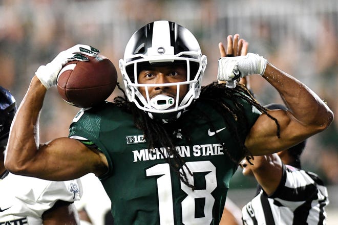 Michigan State's Felton Davis III celebrates after scoring on a two-point conversion during the fourth quarter on Friday, Aug. 31, 2018, at Spartan Stadium in East Lansing.