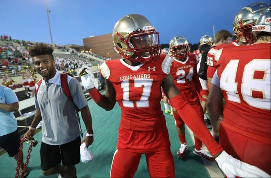 Amar Gist, of Bergen Catholic, celebrates on the sideline as the final seconds click off the clock in the fourth quarter in Buford, GA. Friday, August 31, 2018