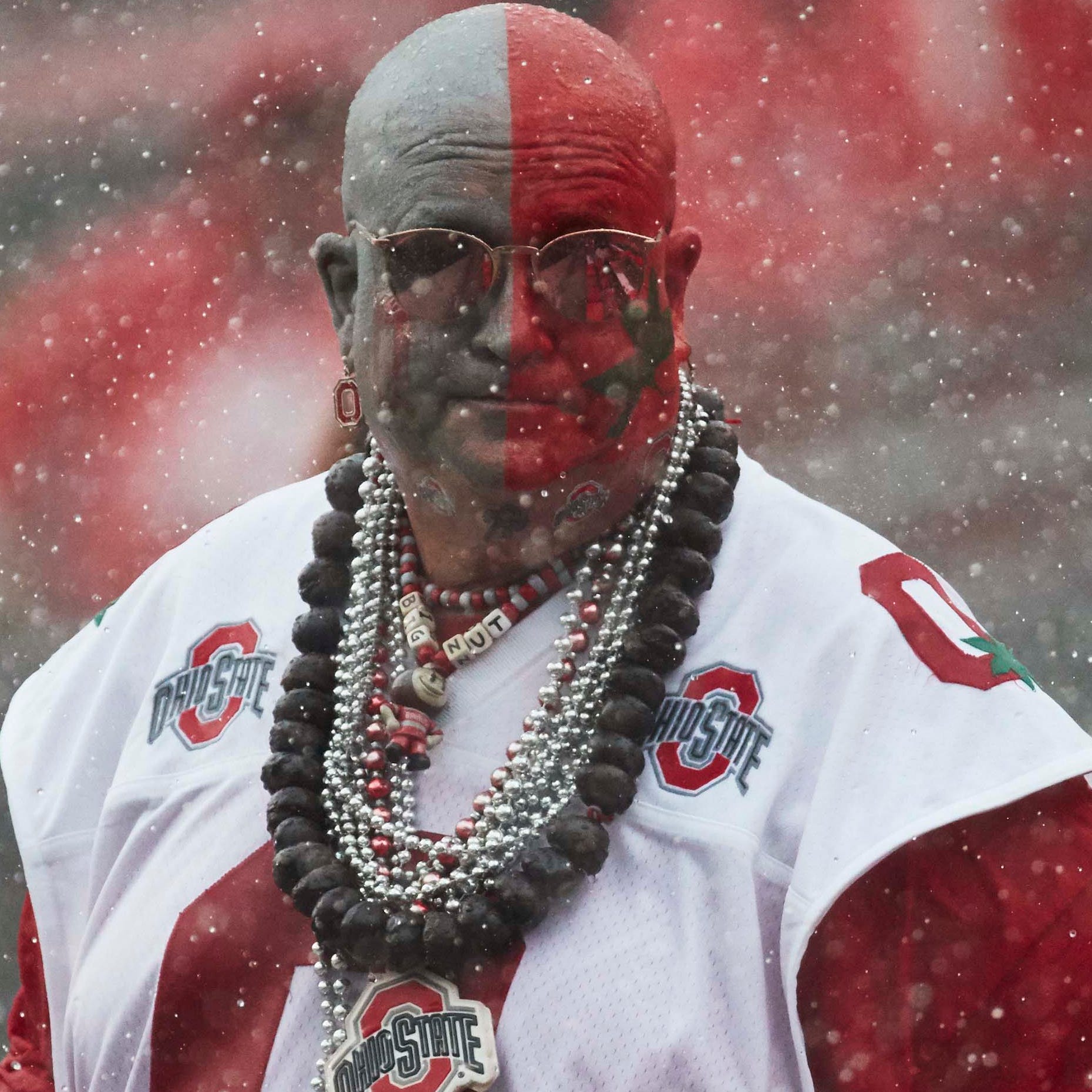 Ohio State Buckeyes fan Big Nut waits in the rain during a weather delay of the game with  Oregon State.