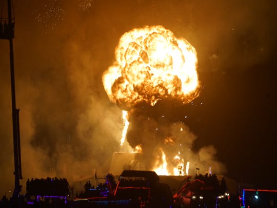 A fireball marks the pyrotechnic end to Burning Man, in which the giant effigy is burned on the final night of the weeklong arts festival in the Nevada desert.